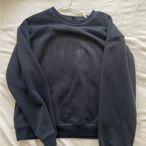 Faded “paradise” graphic black crew neck